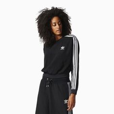 This Women's 3-Stripes Cropped Sweatshirt from Adidas is designed with a slim fit and stylish cropped length. It features the brand's iconic 3-Stripes logo on the sleeve and a wide, slightly raised neckline. Perfect for high intensity workouts or everyday activities. Color: Black White Style: BJ8182 Affordable Adidas Athleisure T-shirt, Sporty Black Tops With Contrast Stripes, Adidas Crew Neck Sweatshirt With Three Stripes, Adidas Three Stripes Sportswear Sweatshirt, Black Casual Sweatshirt With Contrast Stripes, Black Tops With Side Stripes For Streetwear, Adidas Sportswear Sweatshirt With Three Stripes, Adidas Three Stripes Sweatshirt Sportswear, Sporty Adidas Sweatshirt With Three Stripes