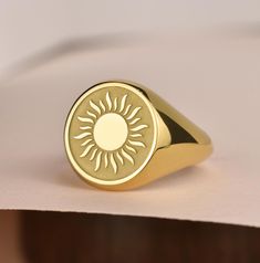 Welcome to LUXJ, Here you will find a beautiful selection of round signet rings with a variety of designs such as our sun signet ring. Our team is happy to assist you with any questions you may have and we look forward to creating these special jewelry for you. *The images are taken from us and you will receive your ring as shown* | Information about the ring | - Face Size: 14x14mm - Band width at the bottom: 4mm | Material | - Sterling Silver 925 - Gold Vermail (925 base) - 9K Real Gold (375) - Women Gold Ring, Dainty Gold Ring, Sun Ring, The Ring Face, Dainty Gold Rings, Signet Rings, Gold Sun, Etsy Gold Ring, Special Jewelry