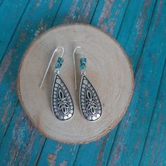 Unique Silver Engraved  Teardrop design with Turquoise Gemstones Length: 1 1/2"    Light weight Turquoise Teardrop Pierced Jewelry, Pierced Turquoise Teardrop Jewelry, Turquoise Teardrop Pierced Earrings, Turquoise Teardrop Metal Jewelry, Turquoise Teardrop Earrings For Jewelry Making, Turquoise Teardrop Metal Earrings, Turquoise Teardrop Drop Earrings, Nickel-free Turquoise Teardrop Earrings, Handmade Turquoise Teardrop Earrings