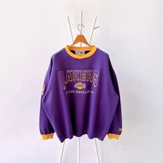 90s Los Angeles Lakers NBA sweatshirt/ XL * PLEASE READ BEFORE PURCHASE * PLEASE consider the PHOTOS before making the decision * The images may DIFFER in appearance from the actual product because we took pictures under daylight.  * PLEASE send your PHONE NUMBER after your purchase for the shipping company to contact you X No returns X No refund Condition : 9/10 More details : look at the pictures  Brand : Lee Size : XL Pit to pit/ Chests : 29/58 inches  Length : 28.5 inches  Material : cotton Purple Letter Print Sweatshirt For Streetwear, Oversized Throwback Sweatshirt For Streetwear, Oversized Throwback Tops For Streetwear, Throwback Crew Sweatshirt For Sports Season, Throwback Crew Neck Sweatshirt For Streetwear, Throwback Oversized Crew Sweatshirt, Oversized Throwback Crew Sweatshirt, Oversized Crew Neck Throwback Sweatshirt, Purple Tops With Ribbed Cuffs For Streetwear