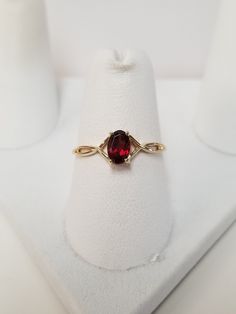 "Thanks for shopping our vintage estate store. We tend to sell well below wholesale and truly hope you enjoy all of our items. Many of the items are one of a kind, so please enjoy scrolling through the pictures and hopefully something will catch your eye. Brown spots are from reflections. Estate 10k yellow gold natural .50ct garnet midi or birthstone ring. Ring size: 7 Setting: 6mm by 4mm 1/4\" Band width: 1mm Weight: 1.0 gram Beautiful ring. Marked 10k." Classic Ruby Ring Collectible, Classic Collectible Ruby Ring, Oval Diamond Ring For Collectible, Classic Oval Ruby Ring, Oval Diamond Ring For Collectors, Classic 14k Gold Birthstone Ring Collectible, Antique Oval Yellow Gold Birthstone Ring, Antique Oval Birthstone Ring Collectible, Antique Oval Birthstone Collectible Ring