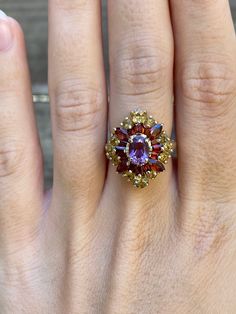 Total Weight: 4.6 grams Size: 6 Band Width: 1.5-3.7mm Garnets: 4x2mm & 3x2mm Amethyst: 6.8x4.6mm Quartz: 3.4mm & 2.3mm Condition: In great condition showing little wear with no damage. All gold has been thoroughly checked with an Olympus XRF spectrometer. It is guaranteed 10k gold.  All our jewelry is properly washed and disinfected to ensure customers get clean items with every order.  Returns accepted but may be subjected to a restock fee.  Please message with any questions:) Heirloom Multi-stone Amethyst Ring, Heirloom Multi-stone Purple Amethyst Ring, Oval Amethyst Multi-stone Ring In Yellow Gold, Elegant Purple Multi-stone Cluster Ring, Oval Multi-stone Garnet Rings, Oval Multi-stone Ruby Jewelry, Purple Multi-stone Cluster Ring For Anniversary, Heirloom Multi-stone Oval Amethyst Ring, Heirloom Oval Multi-stone Amethyst Ring