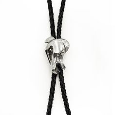 Genuine black leather braided tie with sliding adjustable bolo. Available in Sterling silver, white bronze, bronze and copper with matching bolo tips. Black Adjustable Bolo Ties For Rodeo, Adjustable Black Bolo Ties For Rodeo, Adjustable Black Bolo Tie For Rodeo, Silver Lariat Bolo Tie With Adjustable Cord, Black Adjustable Bolo Tie For Formal Occasions, Formal Adjustable Concho Bolo Ties, Adjustable Formal Bolo Tie With Concho, Western Silver Bolo Tie With Adjustable Cord, Adjustable Western Bolo Tie For Formal Occasions