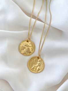 **Each piece in my shop, I personally create and photograph. (All photos are property of The Cord Gallery LLC) Thank you for supporting my small business. These stunning necklaces feature a 24k Matte Gold Plated Roman Style Coin Medallion with a 3D design. Reverses to a different pattern on the back side. Each coin is slightly asymmetrical adding to its interest and character.Hangs on a Gold Filled Curb chain. These make great layering and stand alone pieces!{Coins Measure 27mm}Select your neckl Roman Style, Gold Coin Necklace, Roman Fashion, Roman Coins, Trendy Necklaces, Chain Extenders, Stunning Necklace, Coin Necklace, Gold Filled Jewelry