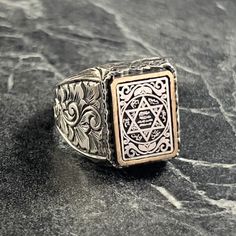 Men Seal Of King Solomon Silver Ring , Men Solomon Signet Ring , New Arrival Ring , Star Of David Jewelry , 925K Protection Rings For Men , Gift For Him , Same Day For Shipping ✧ Product Details * Handmade İtem * Gender : Male / Female * Material : 925K Sterling Silver * Ring Weight : 14.5 Grams ✔ Usage Details * Silver jewelry is very sensitive to chemicals. It is recommended to keep away from chemical substances such as cream, bleach, deodorant, detergent. * Silver jewelry can also darken quickly in salt water, that is, in sea water. For this reason, it is best to remove them when swimming in the sea. ✔ Shipping * Your orders placed on weekdays are delivered to the cargo on the same day. Your orders placed on the weekend are delivered to the cargo on Monday. ✔ Other Details * Our product Spiritual White Gold Engraved Ring, Silver Engraved Star Of David Ring, Protection Rings, Silver Ring Men, Chemical Substances, King Solomon, Ring Men, Star Of David, Ring Collections