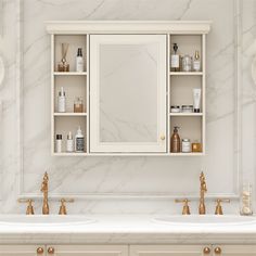 a white bathroom with marble counter tops and gold faucets