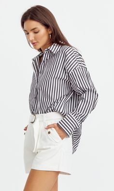 The oversized blouse that's not to oversized. This cotton blouse has a loose fit but keeps the perfect length. Wear with jeans to look effortless or tuck into some shorts for casual outings. Blouse Long sleeve Cuffed Button front Striped Self: 100% Cotton Length: 27 1/2" Chest: 22 1/2" Hand wash in cold water. Lay flat to dry. Low iron. Model is wearing a size small Style #: G241T6930 Trendy Shirt With Shirttail Hem For Daywear, Chic Everyday Shirt With Shirttail Hem, Oversized Effortless Shirt With Shirttail Hem, Oversized Effortless Blouse For Day Out, Chic Shirt For Daywear With Relaxed Fit, Effortless Oversized Blouse For Day Out, Chic Shirttail Hem Shirt For Everyday, Trendy Relaxed Fit Shirt With Shirttail Hem, Trendy Shirt With Relaxed Fit And Shirttail Hem