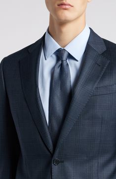 Premium wool woven in a dusky-blue plaid brings polish and distinction to a suit that's styled to make a smart, versatile addition to any formal wardrobe. Jacket has notched lapels; chest welt pocket; flap pockets; interior pockets; side vents Trousers have zip fly; slant pockets; back button-welt pockets Jacket is lined; trousers are lined to the knee Unhemmed 100% virgin wool Dry clean Imported Elegant Plaid Blazer For Business, Elegant Plaid Suit For Semi-formal Occasions, Elegant Plaid Suit With Notch Lapel, Plaid Wool Suits For Formal Occasions, Elegant Plaid Business Suit, Luxury Plaid Suit For Formal Occasions, Blue Tailored Ties For Business, Classic Plaid Suits For Formal Occasions, Formal Plaid Suits With Notch Lapel