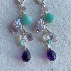 *please note if you are purchasing on facebook or instagram shops you will receive this item in sterling silver with a hook earwire, not the leverbacks shown, with no metal options. I designed this cascade of color for my February birthstone/birthday people. Happy Birthday! I've used scorolite opal, purple freshwater pearls, amazonite, amethyst in purple and pink (it's a lavender) and freshwater pearls. Please choose your earwire and metal choice. These are wired sterling silver on sterling silv Fusion Style Dangle Earrings For Jewelry Making, Fusion Style Dangle Jewelry For Jewelry Making, Elegant Silver Earrings For Birthday, Handmade Dangle Jewelry For Birthday, Teardrop Cluster Earrings For Jewelry Making, Handmade Purple Sterling Silver Chandelier Earrings, Teardrop Gemstone Jewelry For Birthday, Handmade Fusion Long Drop Jewelry, Everyday Fusion Style Sterling Silver Jewelry