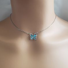 Beautiful Blue Butterfly Necklace Condition: New Material: Silver Plated Length: 18in With 4in Extender Adjustable Silver Butterfly Necklace With Clavicle Chain, Silver Butterfly Necklace With Adjustable Clavicle Chain, Blue Metal Jewelry With Adjustable Chain, Light Blue Choker Jewelry Gift, Dainty Blue Jewelry For Party, Blue Alloy Necklaces For Party, Blue Adjustable Clavicle Chain Jewelry, Adjustable Blue Collar Necklace, Blue Adjustable Chain Choker Jewelry