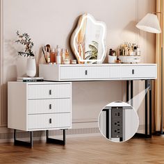 a white dresser with drawers and a mirror on it's side next to a lamp