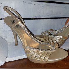 Light Gold Rhinestone And Glitter Heels. These Have Only Been Worn Once. Very Clean. There Is A Very Small Spot On The Outer, Lower Band Where The Glitter Has Came Off. You Cannot See It When You Have Them On. Heel Height Of 4.5" I Do Live In A Smoker's Home. Please Be Kind And Remember...Items Can Be Washed Or Sprayed With A Fabric Spray. The Smell Will Come Out! I Do Wash All Items Before Shipping, Unless They Are New With Tags, Leather, Or Shoes. I Will Do My Best To Ship Them To You With Lov Gold Heels With Rhinestones In Synthetic Material, Gold Synthetic Heels With Rhinestones, Sparkling Synthetic Heels For Prom, Glamorous Bling Heels For Gala, Bedazzled Round Toe Heels For Prom, Bedazzled Gold Open Toe Heels, Bedazzled Open Toe Heels For Prom, Bedazzled High Heels For Gala, Bedazzled Gold Heels For Party