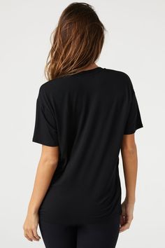 Lightweight, full-length tee with a relaxed fit and a deep v-neckline. This modal tank is ultra comfortable, softer than soft, and breathable. It's a hard-to-beat trio in our famous modal fabric. You'll live in it, and we don't blame you. Color: Black Sizing: S/M (0-4), M/L (6-10) Model is 5'8" and wearing a size S/M Fabric: 92% Micro Modal, 8% Spandex Care: Hand Wash Cold. Lay Flat to Dry. Made in Los Angeles Sporty V-neck Tops For Loungewear, Relaxed Fit V-neck Tops For Relaxation, Sporty V-neck T-shirt For Loungewear, Short Sleeve Athleisure Tops For Relaxation, Relaxed V-neck Top For Loungewear, Summer V-neck Athleisure T-shirt, Athleisure Scoop Neck T-shirt With Relaxed Fit, Black Modal Tops For Summer, Relaxed Black Short Sleeve Top