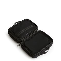 two pieces of black luggage sitting next to each other on a white surface with no one in it