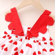 *Title: Baby Girl Heart-shaped Print Bow Decor Ruffle Armhole Dress*Ketword tag: wholesale baby clothes* Fabric: Polyester * Season: Summer * Thickness: Regular * Care Label: On the inside * Package Include: 1 Pieces Sleeveless Heart Print Dress For Valentine's Day, White Cotton Dress With Heart Print, Red Sleeveless Dress With Heart Print, Red Heart Print Summer Dress, Sweet Red Sleeveless Dress, White Sleeveless Dress With Heart Print, Red Heart-shaped Dress For Valentine's Day, Cute Red Valentine's Day Dress, Clothes Fabric