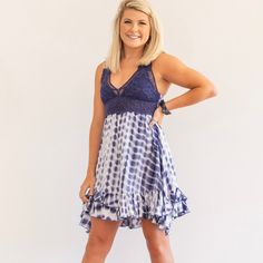 The perfect boho tie dye dress has arrived and we are loving this way too much! Smocked bandeau back with adjustable elastic straps add for comfort and custom length adjustment. Double shoulder straps and removable bra pads added for support. Don't forget the scalloped edges and "x" strap back detail for the perfect aesthetics. When we say this dress is comfortable and gorgeous, we mean it! Imported. Jessica is wearing a size Small Beach Sundress With Built-in Bra, Bohemian Sundress With Adjustable Straps For Beach Season, Bohemian Summer Dresses With Ruffled Straps, Blue Ruffled Straps Sundress For Beach, Bohemian Dress With Smocked Bodice And Ruffled Straps, Bohemian Sundress With Ruffled Straps For The Beach, Bohemian Sundress With Spaghetti Straps And Ruffles, Bohemian Sundress With Smocked Bodice For Beach, Beach Sundress With Lace Trim And Spaghetti Straps