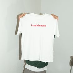 I Could Never Funny Slogan Tik-Tok Viral. Perfect for a fun gift! A classic unisex t-shirt that works well with any outfit. Made of a heavier cotton with a double-stitched neckline and sleeves.- Rolled-forward shoulders for a better fit- Stylish fitted sleeve- Seamless double-needle collar- Taped neck and shoulders for durability- Tubular fit for minimal torqueThis product is made on demand. No minimums. Everyday Crew Neck T-shirt In Ring-spun Cotton, Everyday Screen Print T-shirt In Ring-spun Cotton, Everyday White Ring-spun Cotton Tops, White Cotton Slogan T-shirt, Basic White Ring-spun Cotton T-shirt, White Basic Ring-spun Cotton T-shirt, Unisex Pre-shrunk T-shirt For Everyday Wear, Unisex White T-shirt With Letter Print, Unisex White Cotton T-shirt