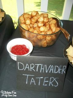 there is a bowl of tater tots next to a sign that says darthwadder taters