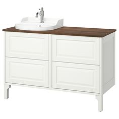 a white sink sitting on top of a wooden counter next to a cabinet with drawers