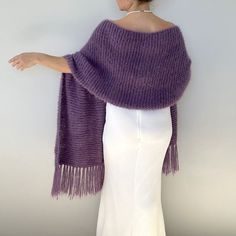 Wedding violet wool shawl, bridal purple mohair wrap, woman evening scarf, gift for her, knitted cover up, winter wedding, fringed    This versatile violet wrap piece not only complements any outfit but also provides warmth and protection from the chilly weather throughout fall, winter, and spring. These cover up's make an excellent bridesmaid gift. Fuzzy and warm yarn. it is not itchy at all. My proucts are handmade. MATERİAL: 10% mohair, 10% wool, 80% premium acrylic-Polyamid, COLOR:PURPLE /VI Winter Shawl For Women, Elegant Handmade Mohair Shawl, Handmade Elegant Mohair Shawl, Elegant Alpaca Shawl Scarves, Handmade Purple Shawl For Winter, Handmade Purple Winter Shawl, Mohair Shawl, Purple Shawl, Evening Scarf