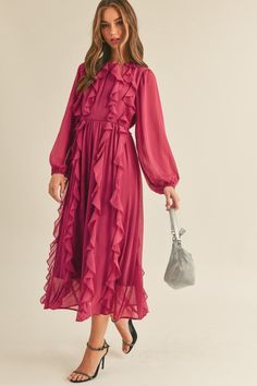 Make a statement in this stunning Ruffle Trim Midi Dress in Magenta Berry. The dress features long puff sleeves with elastic cuffs and a round neckline, making it perfect for any occasion. The cinched waist with an elastic back creates a flattering silhouette, while the midi skirt with ruffle trim detail adds a touch of elegance. The dress is fully lined, ensuring maximum comfort, and the keyhole back with tying detail adds a chic finishing touch. Dress it up with heels or keep it casual with sa Holiday Midi Dress, Midi Long Sleeve Dress, Gold Clothing, Classy Clothing, 2024 Dresses, Ruffle Neck Dress, Burgundy Outfit, Puff Sleeve Midi Dress, Apostolic Fashion