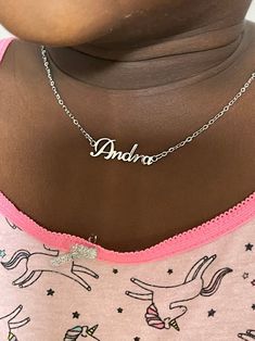 This necklace features a Dainty Sterling Silver Personalized Name Necklace with Chain. You can have your own name or word made. All carving will be made in the font as the photo. This necklace and chain are dainty #namenecklace #childrenday #childrensday #giftforkids #silvernecklace Adjustable Nameplate Necklaces With Names, Personalized Adjustable Nameplate Necklaces, Adjustable Nameplate Necklace With Names, Adjustable Name Necklace For Personalized Gift, Custom Name Letter Necklaces For Personalized Gift, Custom Name Letter Necklace For Personalized Gift, Adjustable Name Necklaces For Birthday, Adjustable Name Necklace For Birthday, Silver Charm Necklace With Names For Birthday