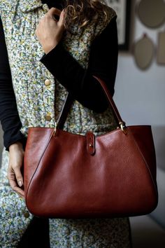 This handmade leather bag is made with 100% natural full grain leather which is tanned with all natural materials. There is no chemical materials in this leather. This bag is handmade in our studio in Milan. The lining is 100% cotton and it is easy to clean. The bag has one middle divider which is a big zipped pocket. There is One smaller zipped pocket in one side and 2 small open pockets All the bags will come with a cotton dust bag which can protect the leather and bag when it is not in use. I Chic Everyday Shoulder Bag In Vegetable Tanned Leather, Elegant Everyday Shoulder Bag In Vegetable Tanned Leather, Timeless Leather Shoulder Bag With Leather Handles, Chic Everyday Satchel With Leather Backing, Chic Everyday Vegetable Tanned Leather Shoulder Bag, Elegant Vegetable Tanned Leather Shoulder Bag For Everyday Use, Classic Satchel With Leather Lining For Every Day, Elegant Top Handle Bag In Vegetable Tanned Leather, Elegant Vegetable Tanned Leather Bag With Top Handle