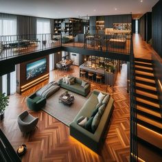 a living room filled with lots of furniture next to a fire place and staircase leading up to the second floor