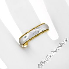 Here we have a well made men's band ring crafted in solid 18k white and yellow gold and features plain domed center framed on both sides with outstanding milgrain etching work for a wonderful look. The band measures 5.5mm in width and shows very nice high-polished finish throughout. Like new, and absolutely ready to wear piece. Enjoy! Material: Solid 18K White and Yellow Gold Weight: 8.47 Grams Ring Size: 6.5 (We CANNOT custom size this ring.) Ring Width: 5.5mm Ring Height:2.25mm rise off the fi Classic White Rings With Decorative Band, Mens Band Rings, Montclair Nj, Wedding Band Ring, Ring Crafts, Mens Band, Ring Ring, Band Ring, Wedding Ring Bands