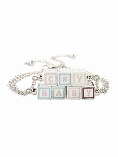 a bracelet that says cry baby on it with blocks in the shape of cubes