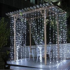 an outdoor gazebo covered in white lights