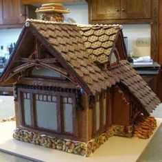 a gingerbread house is on display in the kitchen