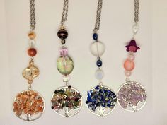 four necklaces with different colors and designs on them