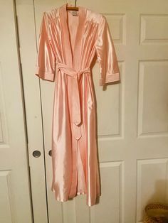 Fabulous pink satin gown , this has a great look ! Nice shape , lots of shine , I love thr pleats at the shoulders, this would definitely be great as a evening jacket 😬 Size S  Shoulder to hem approx 54" Sleeves approx 17" Shoulder to shoulder approx 15" Armpit to armpit approx 16 1/2" See photos Pink Satin Robe, Pink Satin Gown, Evening Jacket, Evening Jackets, Pajama Robe, Satin Gown, Womens Robes, Pink Satin, Vintage Pink