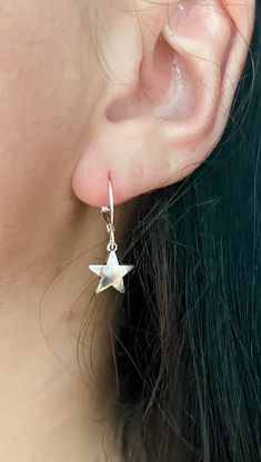 These silver star earrings are the perfect addition to any outfit! They can be great for everyday wear or for a occasion. I love these because they complete my look and add a extra pop to my outfit. I wear them to work, out, run errands and more. Seriously, you can't go wrong with these!! Any of your outfits need some shining through? These are calling your name! This listing is for one pair (1) of mini silver star charm earrings For extra protection of these earrings: - Please avoid contact with moisture for all jewelry. Apply lotions, sprays and perfumes before putting on jewelry. Take off jewelry before exercise and bed. Keeping your jewelry as dry as possible will help prolong the nature of its color and shine. - Store your jewelry when dry only. To clean jewelry, gently use a soft clo Silver Star Charm Earrings, Elegant Star-shaped Nickel-free Hoop Earrings, Silver Star-shaped Sterling Silver Hoop Earrings, Dainty Star-shaped Hoop Earrings For Everyday, Elegant Star Shaped Nickel-free Hoop Earrings, Everyday Star Shaped Pierced Earrings, Minimalist Star-shaped Hoop Earrings For Pierced Ears, Minimalist Star Shaped Ear Wire Jewelry, Minimalist Star-shaped Ear Wire Jewelry