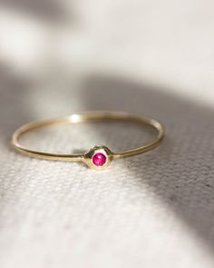 Delicate stacking ring made with strong work-hardened band, 19g. 2mm stone of choice Bezel setting In-stock items ship in 1-3 days. Made-to-order [MTO] items ship in 1-3 weeks. Stackable 14k Gold Ruby Ring For Promise, Promise Stackable 14k Gold Ruby Ring, 14k Gold Stackable Ruby Promise Ring, Stackable 14k Gold Ruby Ring, 14k Gold Rings With Round Stone For Everyday, Everyday 14k Gold Rings With Round Stone, Everyday 14k Gold Ring With Round Stone, Dainty Stackable 14k Gold Ruby Ring, Dainty 14k Gold Stackable Ruby Ring