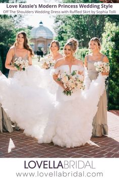 the bride and her bridal party are posing for a photo in their wedding gowns