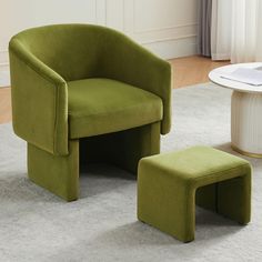 a green chair and foot stool in a living room with white carpeted flooring