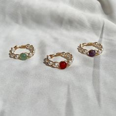 (items are shipped between 1-2 days) A gold braided wire wrapped rings made with pearls and a round gemstone. Available in green aventurine, red carnelian and amethyst. 💗I love pairing these dainty gemstone rings together but they also look cute on their own. They also make great gifts for loved ones.  All orders come in a white mesh bag making them great to gift in.  💗I recommend avoiding water and keeping it stored away when not being worn to maintain its quality. More Crystal Jewelry  Crystal Beaded Rings https://www.etsy.com/listing/1462796716/crystal-beaded-ring-crystal-bead-ring Crystal Bead Wire Wrapped Ring  https://www.etsy.com/listing/1301212761/crystal-ring-crystal-bead-wire-wrapped Mystery Crystal Ring Bundle https://www.etsy.com/listing/1480464853/crystal-ring-bundle-mystery Diy Wire Bead Rings, Braided Wire Ring, Ring Ideas Diy, Cute Wire Rings, Diy Stone Rings, Gold Wire Ring, Diy Ring, Gold Wrap Ring, Diy Wire Jewelry Rings