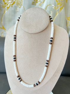 "This Highly Praised Hawaiian Style Native Treasure Puka Shell Necklace is Beautifully Handcrafted in our Tropical Jewelry Shop by our own Native Island Artisans using 5mm (3/16\") Hand-Selected Class 'A' Quality Shells with Brown and Black Coco Beads. Select from 14\" to 28\" inch length, priced accordingly. Real Wood Coco Beads from Coconut Trees and Genuine Hand Sorted Shells Indigenous to  the Powder White Beaches of the Philippines. Perfect to take that Tropical Feeling with you! Truly Nati White Jewelry With Black Beads As Gift, White Necklace With Black Beads For Beach, White Necklaces With Black Beads, Adjustable 16 Inch White Jewelry, Adjustable White Jewelry With Black Beads, Surf Necklace, Puka Shell Necklace, Tropical Jewelry, Puka Shell