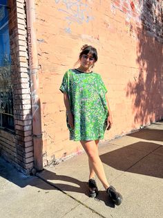 Meet the coziest, comfiest member of our dress lineup- the Circle Dress. Made from our soft stretch jersey and cut to be oversized and roomy, this tunic length dress also features a wide neck hole so you can slip it on with ease and hidden side pockets. Featuring the artwork of Lex Gjurasic Spring Green Cotton T-shirt Dress, Relaxed Fit Short Sleeve Dress For Loungewear, Relaxed Fit Short Sleeve Loungewear Dress, Spring Short Sleeve Tunic For Loungewear, Spring Loungewear Dress With Crew Neck, Oversized Casual Mini Dress For Spring, Relaxed Fit Short Sleeve Tunic For Loungewear, Spring Cotton Dresses With Curved Hem, Casual Flowy Tunic Mini Dress