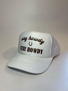 Our Say Howdy Stay Rowdy trucker hat is perfect for this summer. You can dress it up or down and it will elevate your outfit! *THINGS TO NOTE* + Our trucker hats are made from 100% polyester with an adjustable mesh backing, making the hats both breathable and easy to find your perfect fit. + Orders only include trucker hat + One size fits most! + Message us for custom requests! Adjustable Snapback Trucker Hat For Country Events, White Summer Trucker Hat With Flat Bill, White Flat Bill Trucker Hat For Summer, White Country Style Trucker Hat With Curved Brim, White Trucker Hat For Summer Rodeo, Country Style White Snapback Hat, Western White Cap Hat, White Country Style Trucker Hat, Country Style White Baseball Cap