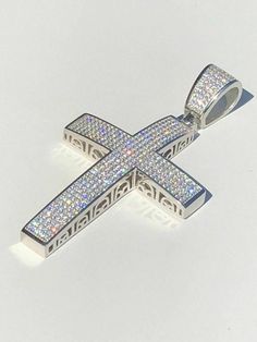 "Stunning Iced Out Moissanite Cross Pendant 2.53 ct VVS D color REAL moissanite stones. PASSES DIAMOND TESTER ANY PEN OR LIGHT TRANSMISSION DIAMOND TESTER (Will show up as moissanite and not diamond on lab assays however) Measures roughly 2\" by 1.5\" (2.5\" with bale) weighs a solid 20 grams! Fits most Chains up to 8mm thick Heavy and Solid piece! Solid 925 sterling silver, rhodium finish Will never change color or go green!! Look just like natural diamonds and without microscope you can't tell White Diamond Spiritual Jewelry, Spiritual White Diamond Jewelry, Iced Out Moissanite White Jewelry, Iced Out White Moissanite Jewelry, White Moissanite Iced Out Jewelry, Iced Out White Pendant Jewelry, Luxury Silver Channel Set Jewelry, White Iced Out Cross Jewelry, White Iced Out Sterling Silver Jewelry