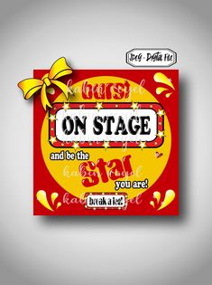 a red and yellow sign with the words on stage