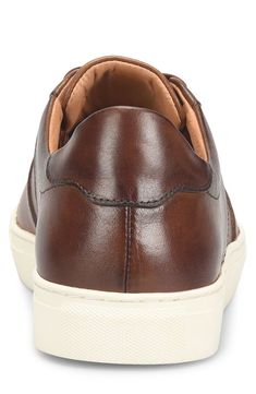 Classic and comfortable, this sneaker topped with softly polished leather features a sporty lace-to-toe profile and a cupsole made of grippy rubber. Lace-up style Removable insole Leather upper and lining/rubber sole Imported Casual Low-top Sneakers With Leather Sole, Casual Brown Cap Toe Lace-up Shoes, Classic Sneakers With Round Toe And Laces, Comfortable Brown Plain Toe Sneakers, Classic Sneakers With Textured Sole And Wingtip Design, Classic Lace-up Sneakers With Contrast Sole, Casual Lace-up Shoes With Cap Toe And Rubber Sole, Casual Lace-up Golf Shoes With Rubber Sole, Casual Leather Cap Toe Sneakers