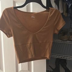 Brown Pacsun Crop Top. V Neck. Never Worn Brand New With Tags Brown Fitted Crop Top For Vacation, Brown Spring Beach Crop Top, Summer Brown V-neck Top, Brown V-neck Summer Top, Brown Summer Crop Top For Vacation, Summer Brown Crop Top For Vacation, Chic Brown Crop Top For Vacation, Trendy Brown Crop Top For Day Out, Brown V-neck Crop Top For Spring