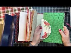 a woman is working on some crafting projects with scissors and paper work in front of her