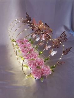 pink roses and butterfly hair combs with fairy lights