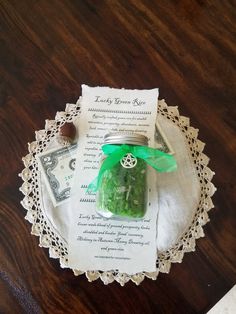 a mason jar filled with green stuff sitting on top of a doily