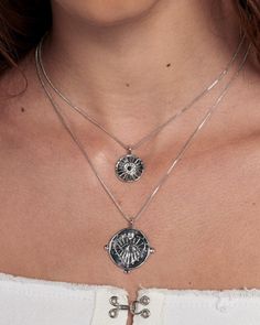 Our best-selling double coin charm necklace with embossed evil eye design Sold as a set of 2 necklaces- Necklaces are NOT connected and can be worn separately Chains are 16" and 18", both with 2" of extender chain Smaller charm is 0.65" (16.6 mm) Larger charm is 0.92" (23.5mm) Made From Brass with Swarovski Crystals Plating is 0.03 microns + e-coating for long lasting durability Plated high polish Rhodium for maximum shine Both chains have a lobster clasp closure Necklace is 100% nickel-free and Evil Eye Necklace Silver, Personalised Jewellery Necklaces, Silver Coin Necklace, Evil Eye Design, Double Chain Necklace, Swarovski Crystal Bracelet, Swarovski Stones, Small Charms, Eye Design